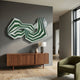 Riborra Green Layered Wood Carving 3D Wall Art by Giant Sculptures, mounted above a walnut sideboard with lamp in a modern living room with green armchair.