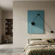 Linavox Blue Geometric Leather 3D Wall Art by Giant Sculptures mounted above a green linen bed, with black discs and taut cords forming a triangle.