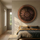 Centriva Brown II Folded Leather Round 3D Wall Art by Giant Sculptures mounted above a bed with grey and mustard linens in a sunlit minimalist bedroom.