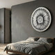 Centriva Cream I Folded Leather Round 3D Wall Art by Giant Sculptures mounted above a wooden bed with grey linen in a modern concrete-walled bedroom.