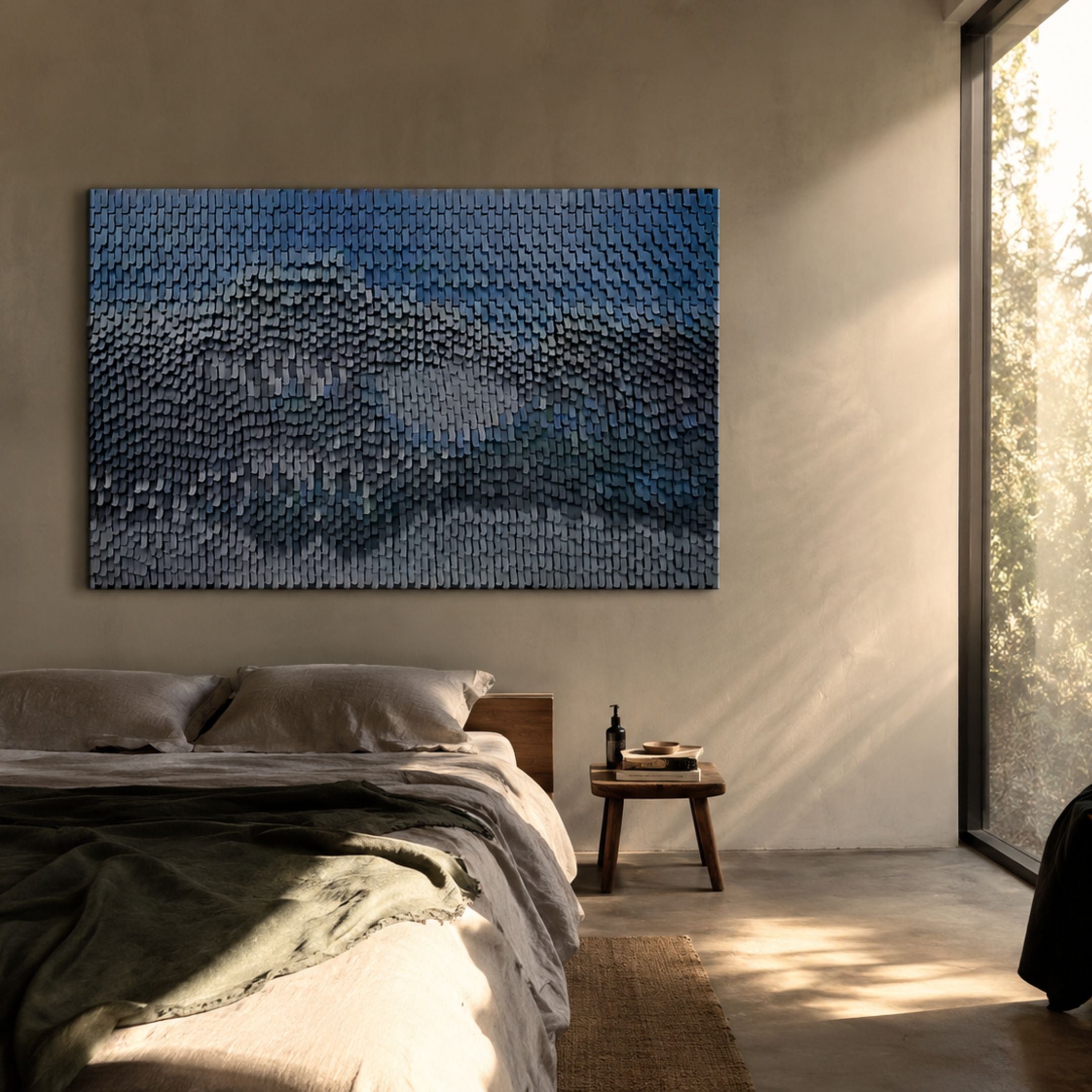 Varentis Blue Ombre Layered Leather 3D Wall Art by Giant Sculptures mounted above a bed with linen bedding and wooden side table in a sunlit bedroom.