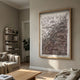 Florasca Mauve Ripple Leather 3D Framed Wall Art by Giant Sculptures displayed on a beige living room wall above a sofa, bookshelf, and wooden coffee table.