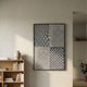 Virelli Slate Grid Dot Mesh 3D Carving Wall Art by Giant Sculptures, displayed in a neutral living space beside a wooden bookshelf with a stoneware vase.