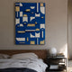 Moduvo Gold Accent Blue 3D Carving Wall Art by Giant Sculptures mounted above a wooden bed, with a globe lamp and stacked books on the bedside table.