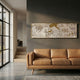 Kinjiro Gold Pagoda Vista 3D Carving Wall Art by Giant Sculptures mounted on a dark grey wall above a tan leather sofa in a sunlit modern living room.
