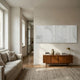 Lineaform Multi-Panel Curve Wood Carving 3D Wall Art in white, mounted above a teak sideboard in a Nordic living room with linen sofa.
