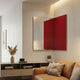 Grilith Red Grid Mirror Dual Panel 3D Wall Art by Giant Sculptures mounted above a low console in a modern living room with a tan leather sofa.