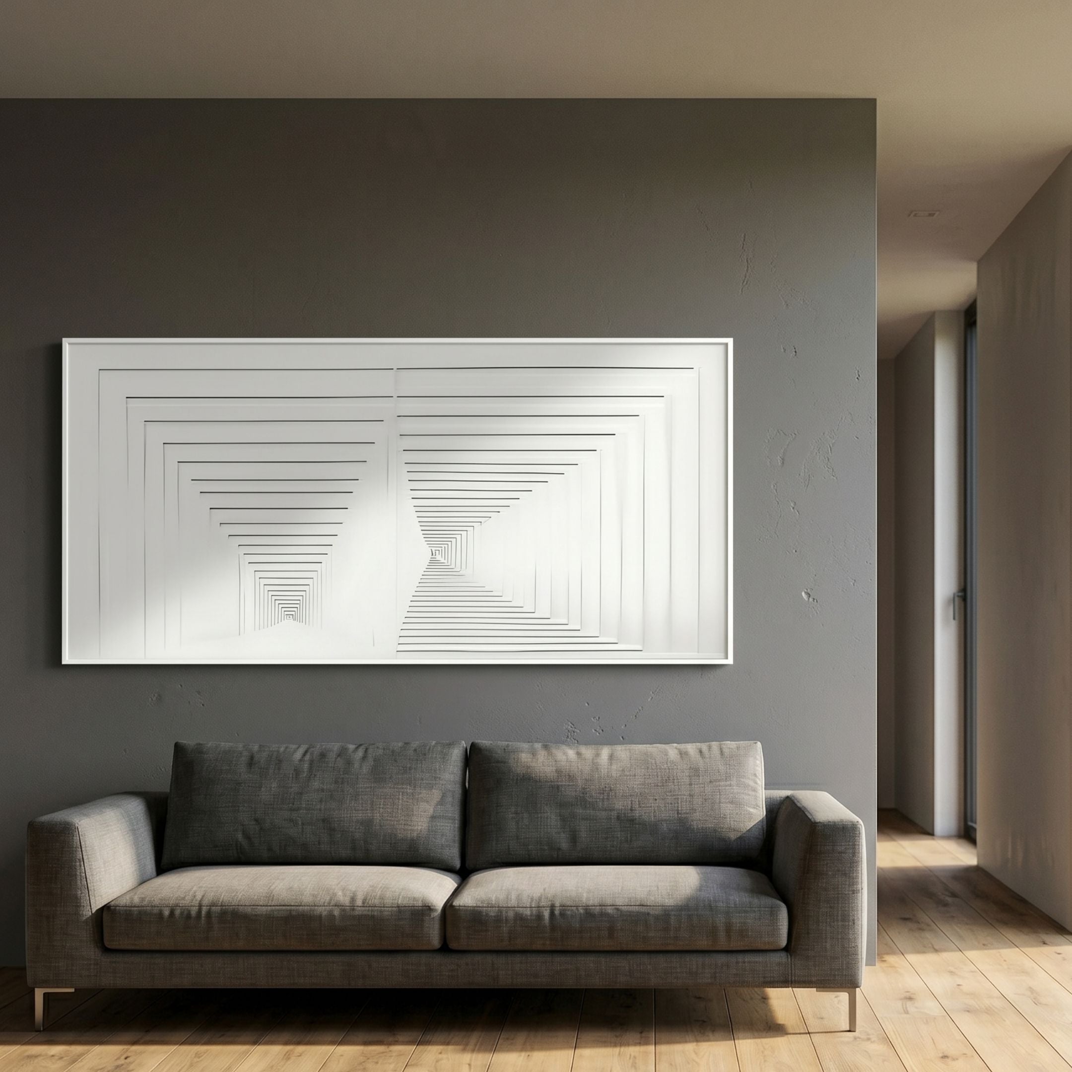 Varelo Horizontal Geometric Relief 3D Wall Art in white, mounted on a grey wall above a charcoal sofa in a modern living room with wood flooring.