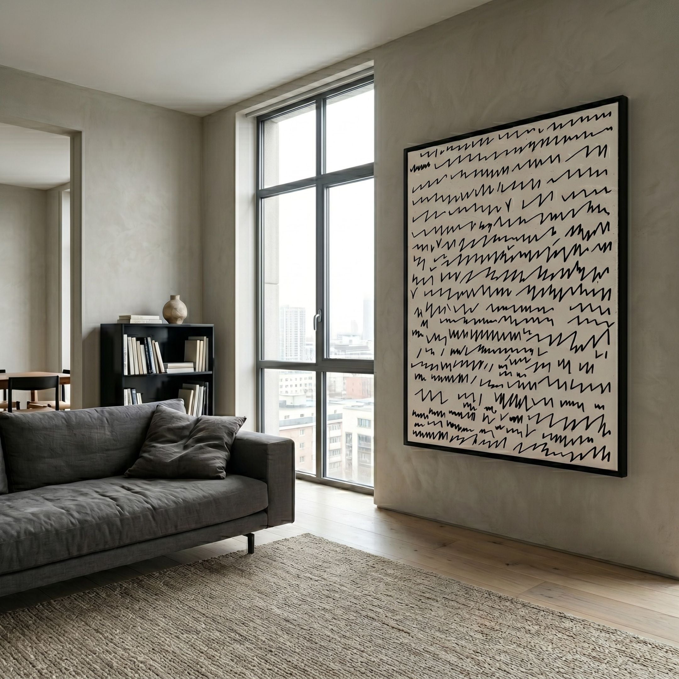 Scriptera Linear Scribble 3D Carving Wall Art by Giant Sculptures, large black-on-white scribble piece mounted in a modern living room beside a grey sofa and window.