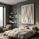 Velistra Dual Curve 3D Relief Wall Art by Giant Sculptures in white, framed above a bed in a grey modern bedroom with shelves, armchair, and window.