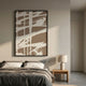 Deralin Mocha Stroke Abstract 3D Carving Wall Art in a black frame above a linen-dressed bed, beside an oak nightstand with a ceramic lamp.