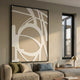 Deralin Taupe Orbital Abstract 3D Carving Wall Art by Giant Sculptures mounted above a beige sofa with olive and blue cushions beside a tall window.