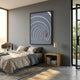 Kairo Radial Flow Slate 3D Carving Wall Art by Giant Sculptures mounted above a linen-dressed bed with a wooden nightstand in a sunlit grey bedroom.