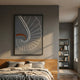 Kairo Spiral Sweep Slate 3D Carving Wall Art by Giant Sculptures displayed above a wooden bed in a grey modern bedroom beside a tall bookshelf.