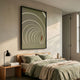 Kairo Radial Flow Olive 3D Carving Wall Art by Giant Sculptures displayed above a wooden bed with olive-green linens, black lamp, and soft natural light.