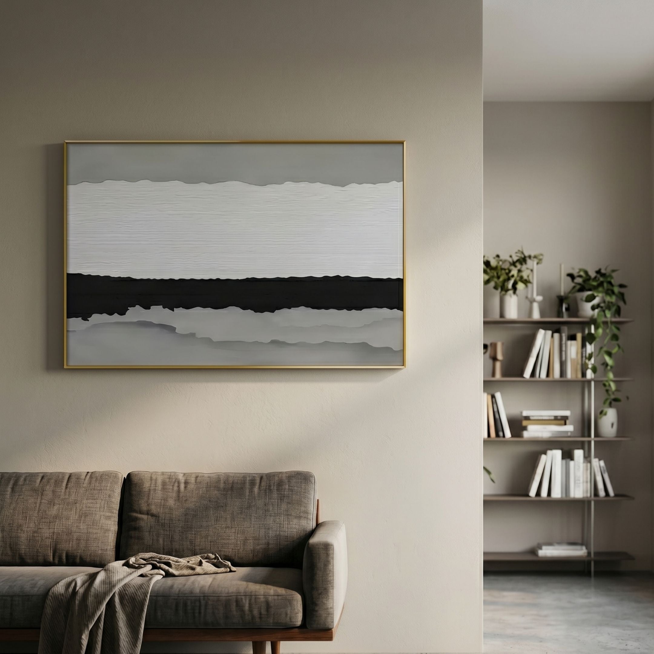 Stratisse Grey Layered 3D Carving Wall Art in a thin gold frame mounted above a brown sofa in a neutral living room with a bookshelf nearby.