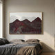 Caelora Sculpted Mesh Landscape 3D Wall Art in maroon, crimson and white with gold frame, mounted above a linen-dressed bed in a warm neutral bedroom.