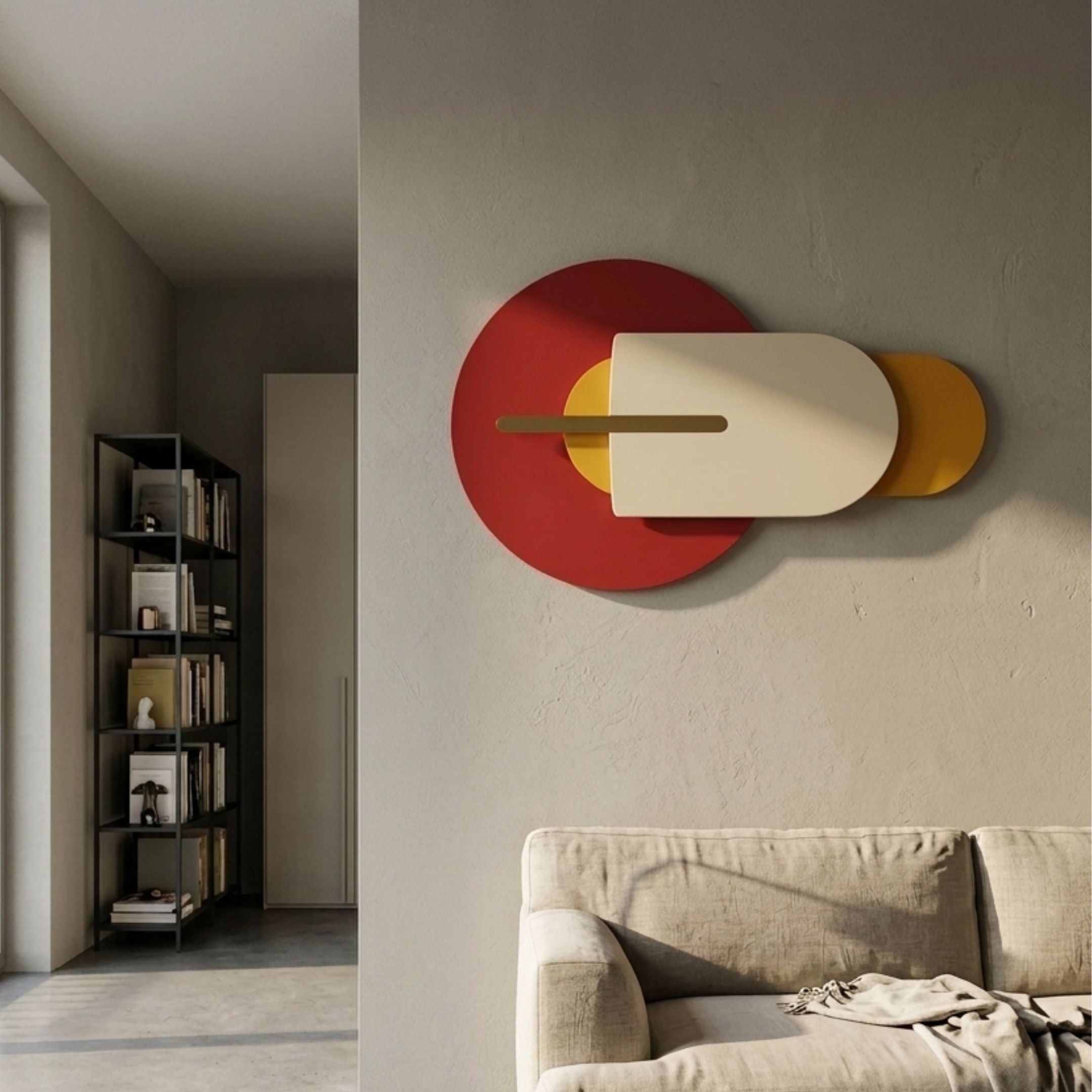 Orbitale Red & Ochre Geometry Wood Carving 3D Wall Art mounted above a beige sofa in a modern living room, with a black bookshelf visible beyond.