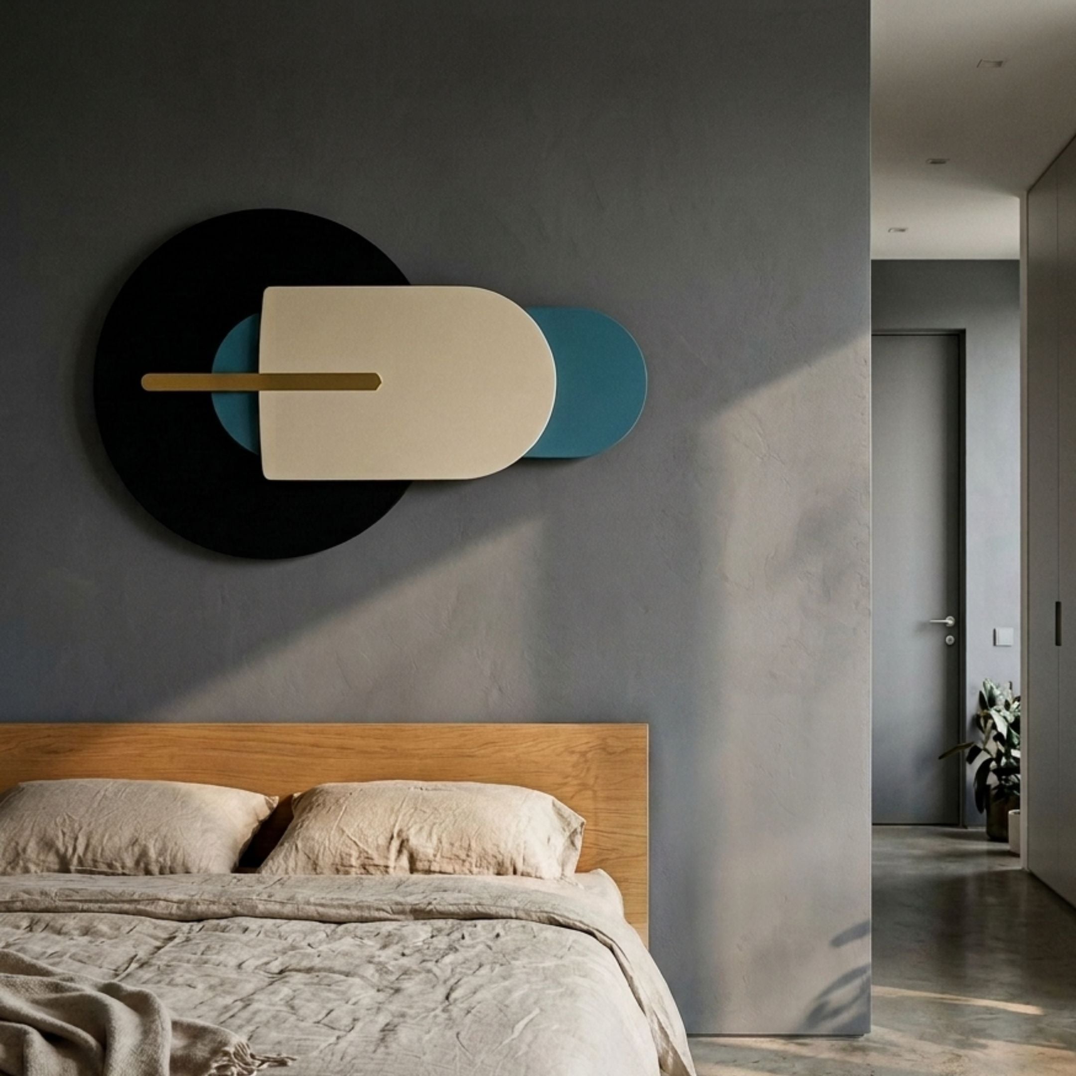 Orbitale Blue & Cream Geometry Wood Carving 3D Wall Art by Giant Sculptures mounted above a wooden bed with linen bedding in a grey bedroom.