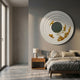 Aethera Golden Leaves Round Wood Carving 3D Wall Art mounted above a wooden nightstand in a modern bedroom with grey walls and linen bedding.