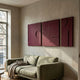 Moro III Triptych Deep Red Relief 3D Wall Art by Giant Sculptures displayed above a sage green sofa in a sunlit living room with plaster walls.