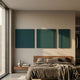 Moro II Triptych Deep Teal Relief 3D Wall Art by Giant Sculptures displayed above a wood-headboard bed with linen bedding in a modern bedroom.