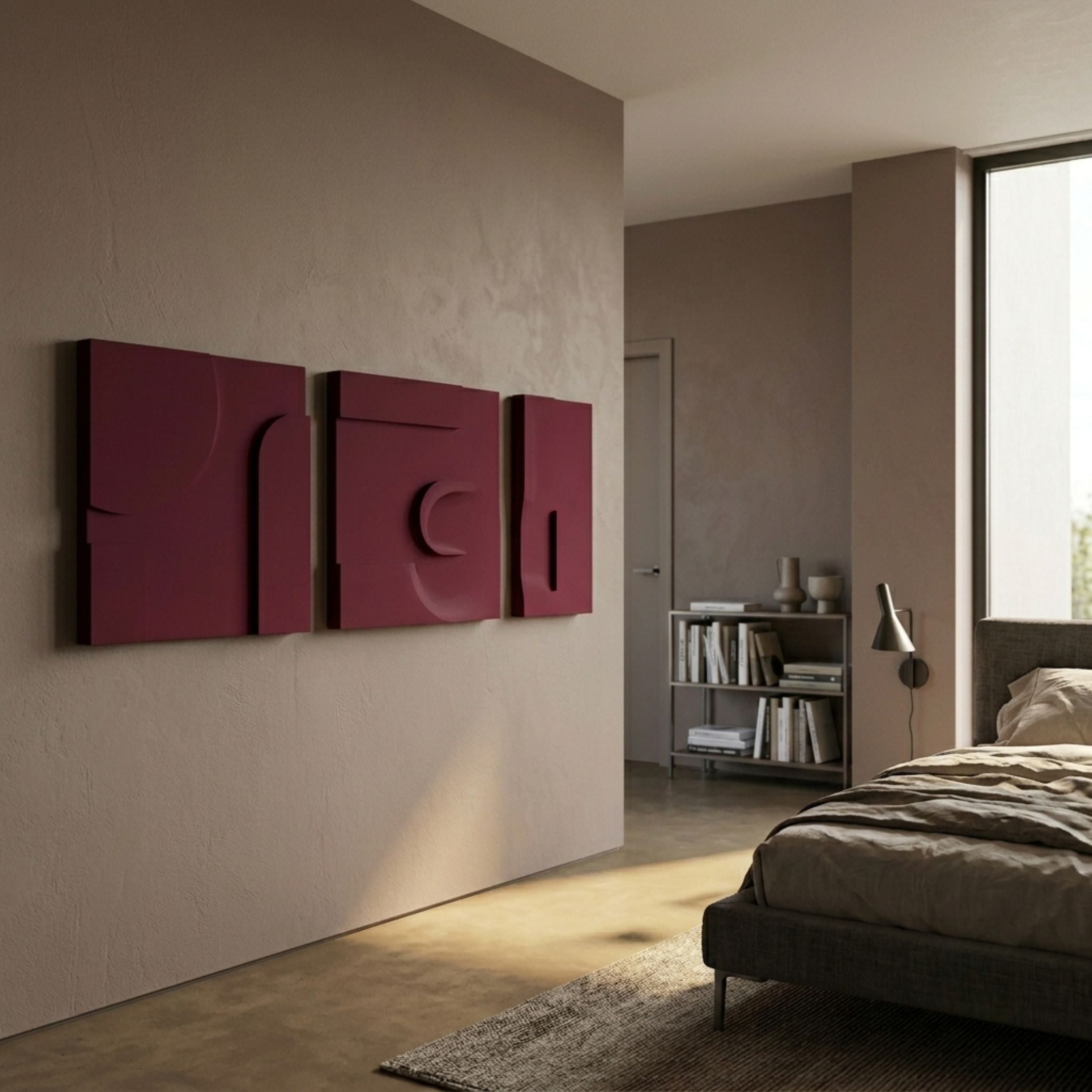 Moro I Triptych Deep Red Relief 3D Wall Art by Giant Sculptures mounted on a taupe bedroom wall above polished floors, near a bookshelf and upholstered bed.