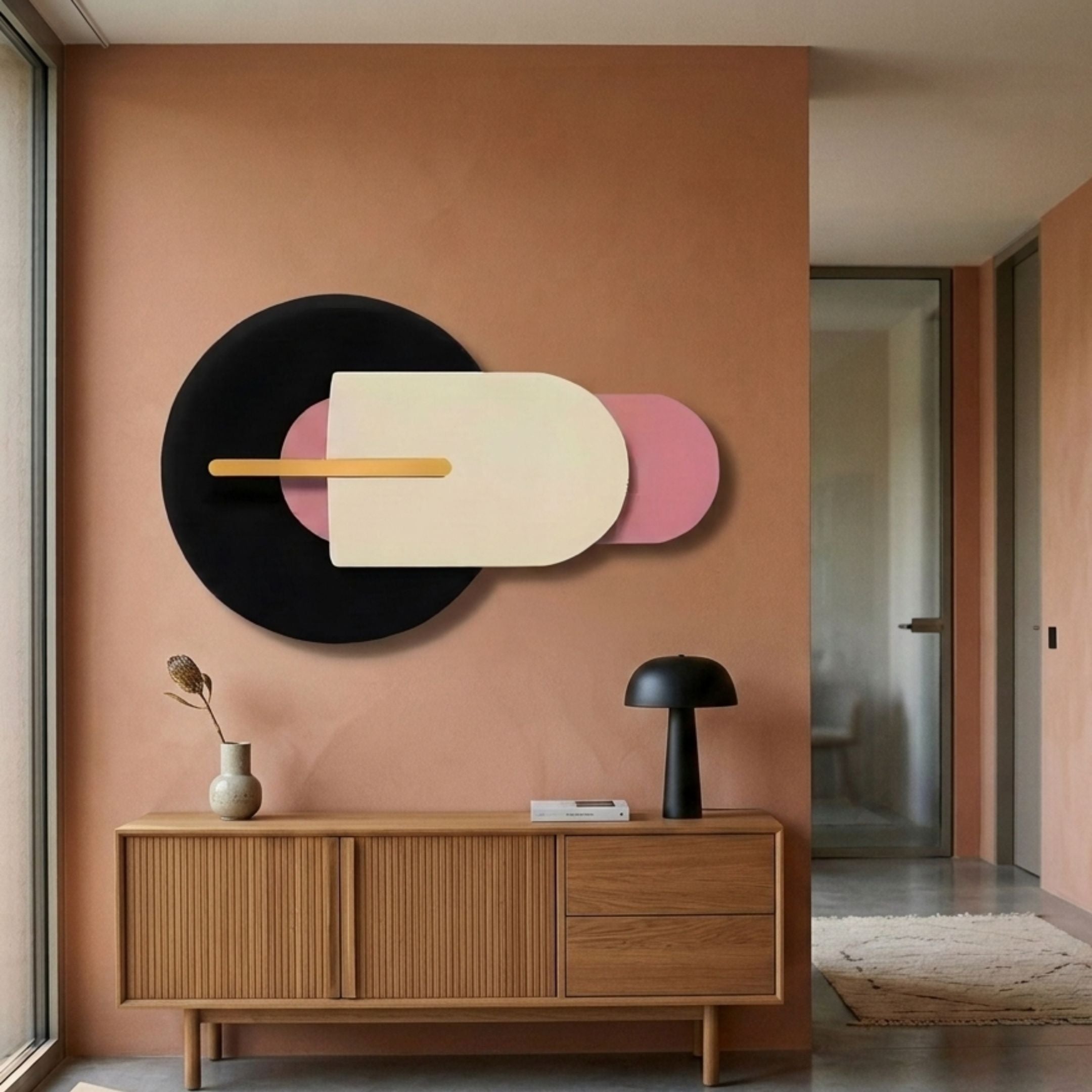 Orbitale Pink & Cream Geometry Wood Carving 3D Wall Art by Giant Sculptures displayed above a slatted wooden sideboard with a black mushroom lamp in a terracotta hallway.