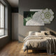 Bloomark Moss Floral White Rose Texture 3D Wall Art with sculpted white roses and green-trimmed flower motif, displayed above a linen bed in a grey bedroom.