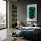 Malachra Crest II Relief Sandstone 3D Wall Art by Giant Sculptures, green organic crest in a white frame, mounted above a nightstand in a modern bedroom.
