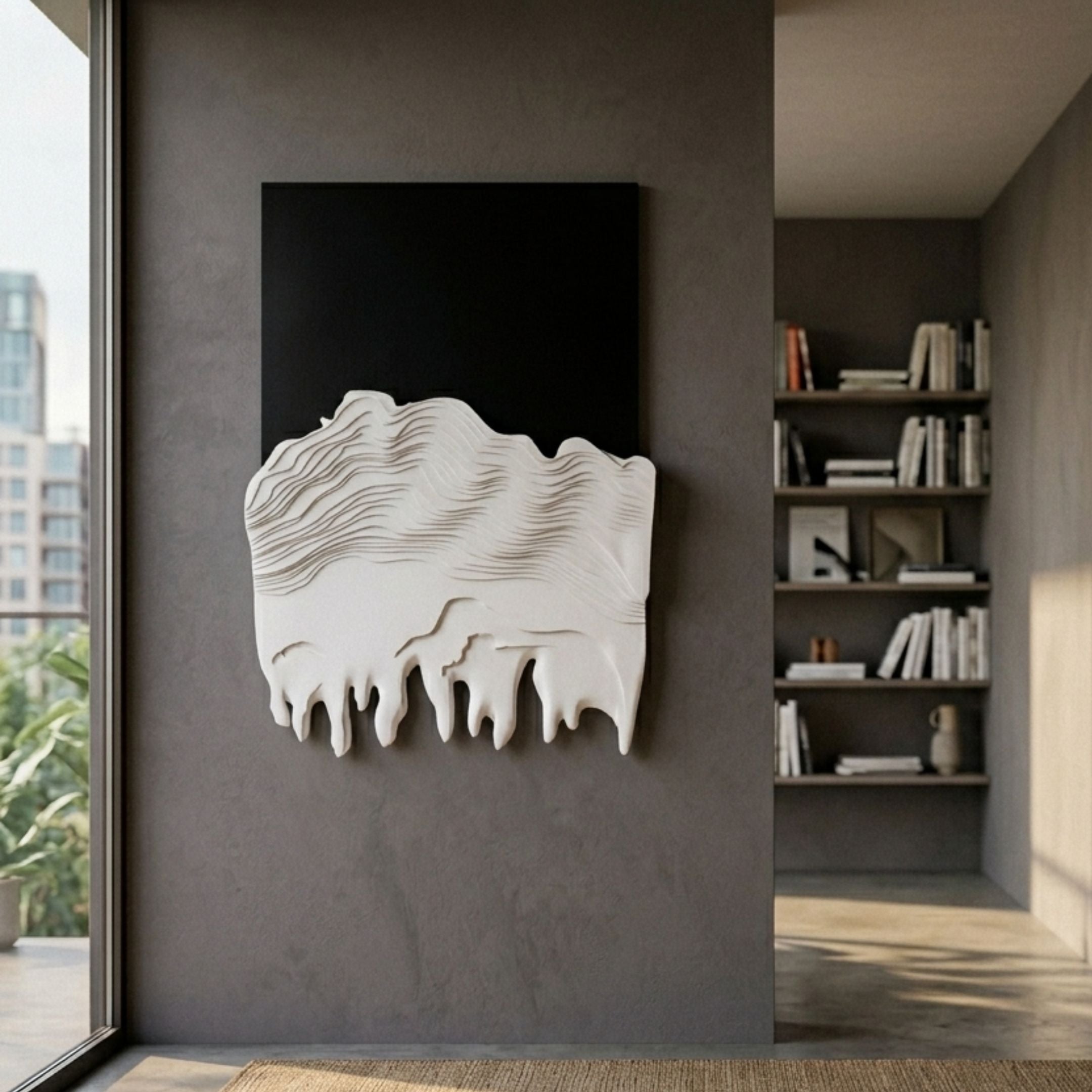Riftline Peakcut Charcoal Wood Carving 3D Wall Art by Giant Sculptures, with black peak above white wavy layered base, mounted in a modern hallway beside bookshelves.