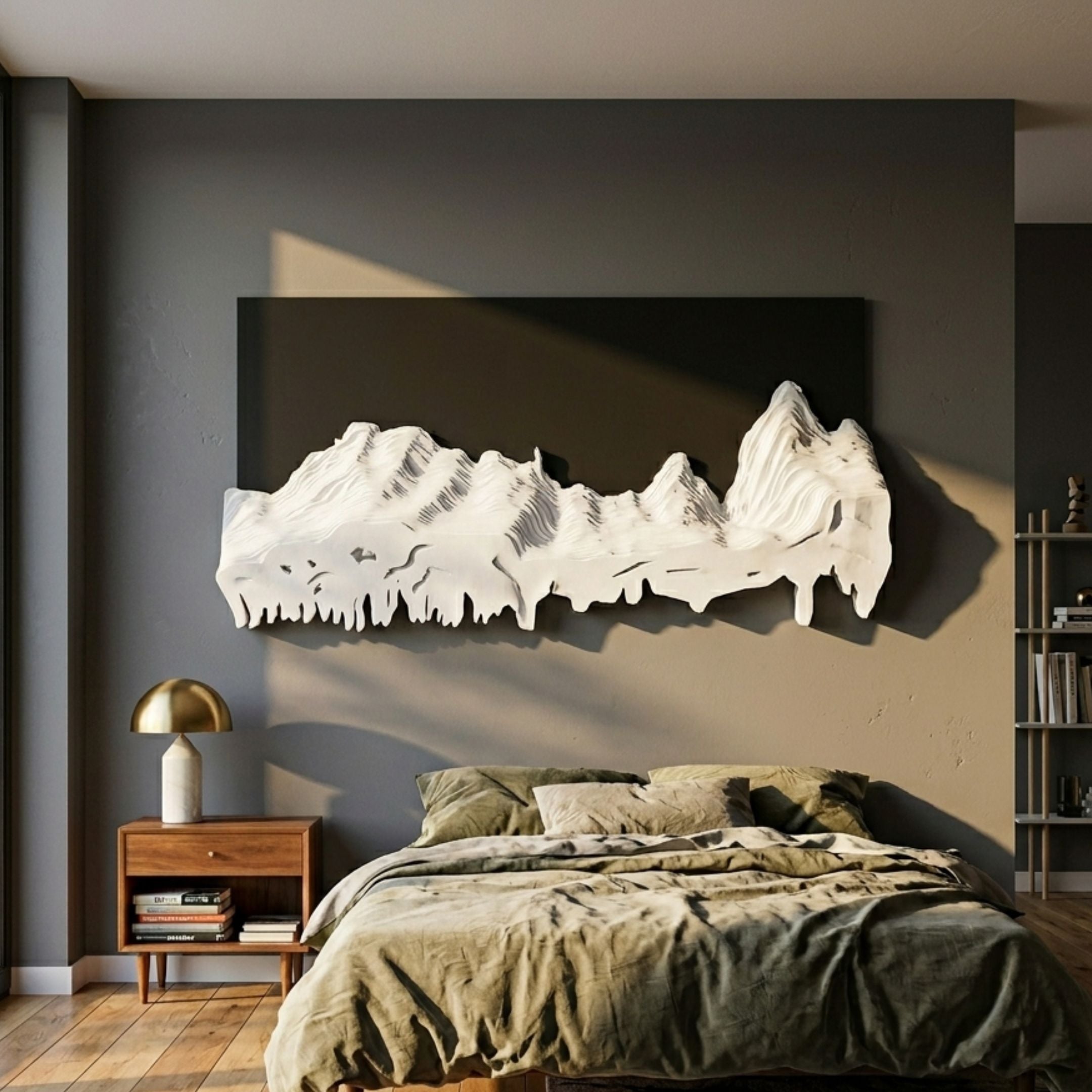 Riftline Ridgecut Charcoal Wood Carving 3D Wall Art mounted on a charcoal panel above a bed with olive linens, walnut nightstand and brass lamp alongside.