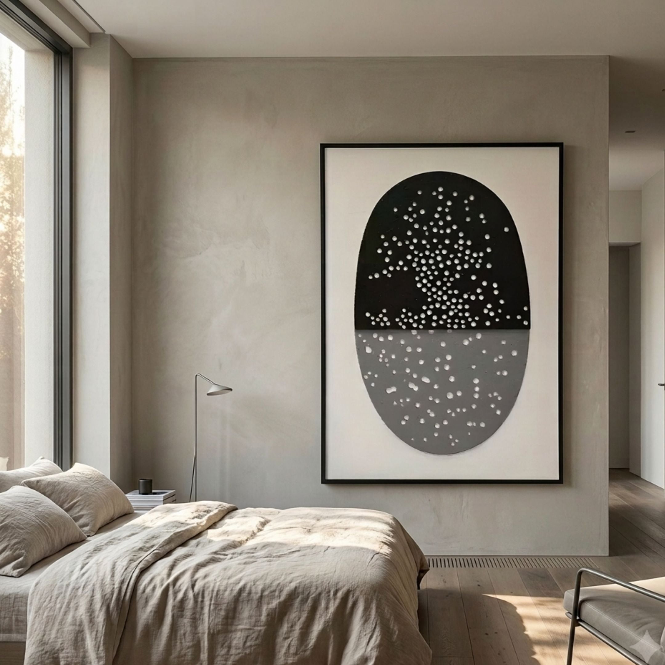 Noctara Orb Dusk Monochrome Carved 3D Wall Art by Giant Sculptures displayed in a minimalist bedroom above a linen-dressed bed, beside a floor lamp and window.