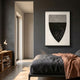 Noctara Crest Mist Monochrome Carved 3D Wall Art by Giant Sculptures, shield form with grey dotted upper half and matte black lower half, displayed above a bed.