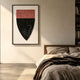 Noctara Crest Mist Rose Carved 3D Wall Art by Giant Sculptures, a framed shield-shaped piece with dotted rose-pink and black sections, hung above a wooden bed.