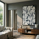 Dunari Midnight Trace II Wood Carving 3D Wall Art with black flowing shapes on white textured field, displayed above a walnut sideboard in a modern living room.