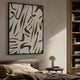 Dunari Olive Trace II Wood Carving 3D Wall Art with white textured surface and mustard-yellow cut-outs in a black frame, above a bed beside a bookshelf.