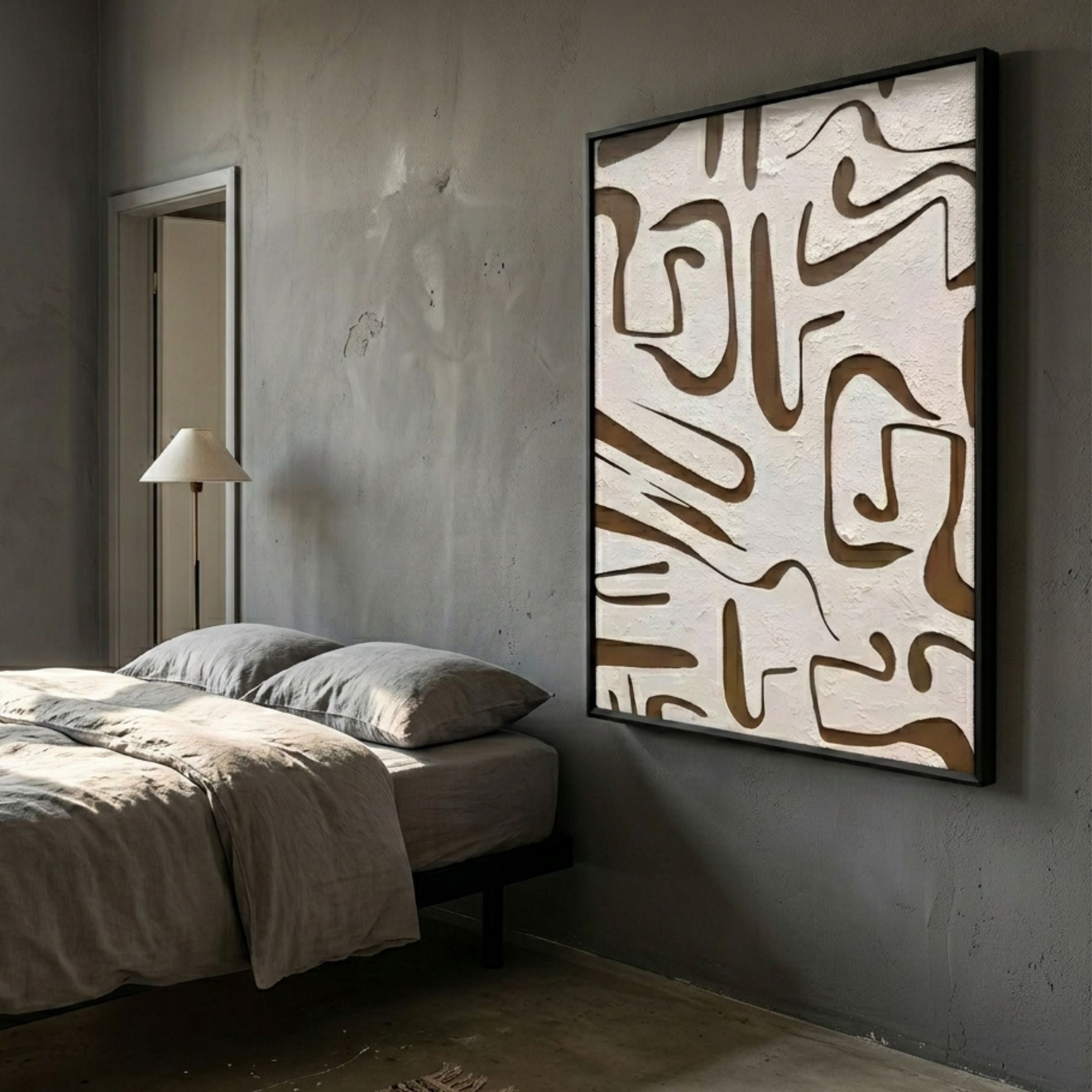 Dunari Earth Trace III Wood Carving 3D Wall Art with textured white surface and brown wood cut-outs in a black frame, mounted above a bed in a grey bedroom.