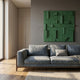 Grida Forest Green II Wood Carving 3D Wall Art by Giant Sculptures displayed on a grey wall above a blue-grey sofa in a modern sunlit living room.