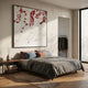 Pellora White & Crimson Leather Scale 3D Wall Art by Giant Sculptures displayed above a grey bed with blue and terracotta cushions in a modern bedroom.