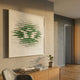 Echovia Green Linear Square Acrylic 3D Wall Art by Giant Sculptures displayed above an oak sideboard with books and a potted plant in a warm interior.