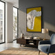 Ravelle Mustard Contour Felt 3D Relief Wall Art by Giant Sculptures displayed above a dark wood console with a vase and lamp in a modern living room.