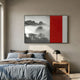 Ryushin Twilight Peaks Red Leather Carving 3D Wall Art with misty mountains and pines beside a red dragon-carved panel, hung above a blue and brown bed.