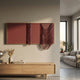 Drapelle Red Flow Layered Leather 3D Wall Art by Giant Sculptures mounted above a light oak sideboard in a modern living room with a beige sofa.