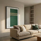 Trivaro Green Panel III Wood Carving 3D Wall Art by Giant Sculptures, framed in black with green panels, beige stripes and ribbed white side, above a beige sofa.