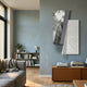 Urbis Black & White Urban Rise Chain Leather 3D Wall Art by Giant Sculptures displayed on a grey-blue wall above a wooden console in a modern living room.