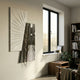 Urbis Black & White Tunnel Chain Leather 3D Wall Art by Giant Sculptures mounted on a pale wall beside a window, near a bookshelf and side table.