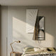 Urbis Black & White Treewalk Chain Leather 3D Wall Art by Giant Sculptures, mounted above a bed with brass lamp, showing angled monochrome stairway panels draped in gold chains.