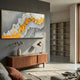 Valmara Grey & Gold Crest Layered Leather 3D Wall Art mounted above a walnut sideboard with brass lamp in a grey-walled modern living room.