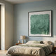 Calavine Green Bloom Sculptural Leather 3D Wall Art by Giant Sculptures displayed above a linen-dressed bed with a wooden nightstand and lamp in a sage bedroom.